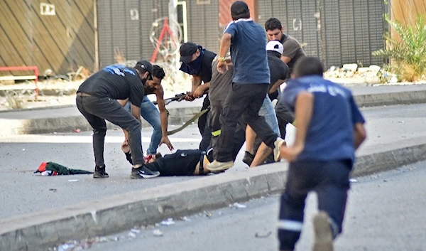 Paramedics rushing to provide medical care for an victim injured during the Tayouneh ambush | AFP