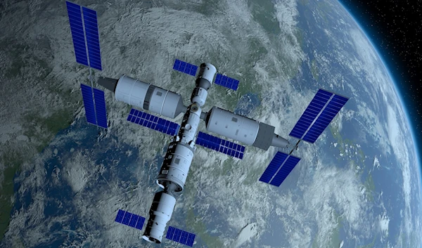 3D illustration of Tiangong, the Chinese space station, orbiting Earth, with Earth in the background | Getty