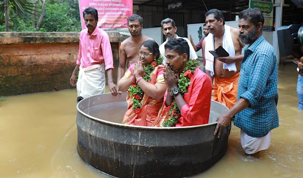 Flood in India Forces Newlyweds to Float to their Wedding