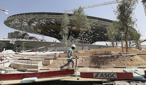 A worker passes in front of the Sustainability Pavilion at the under construction site of the Expo 2020 in Dubai, United Arab Emirates on October 8, 2019 | AP