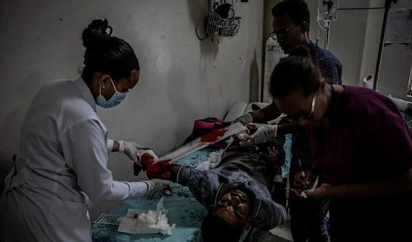 Health care workers in Mekelle treating a man who was injured by a government airstrike on a market in the nearby town of Togoga, in Ethiopia’s northern Tigray region on June 22 | AFP