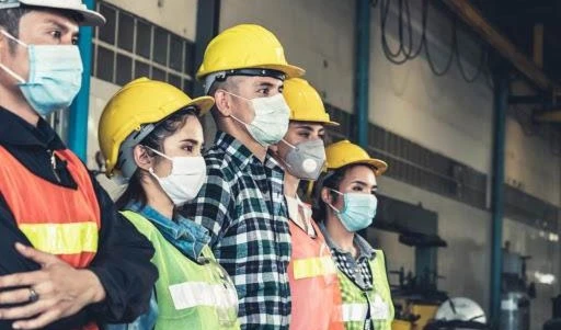 Factory workers with face mask protect from outbreak of COVID-19