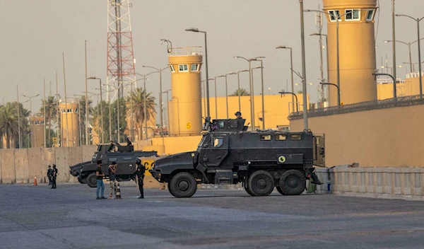 Iraqi Counter Terrorism Forces stand guard outside the U.S. Embassy on May 30, 2021 in Baghdad, Iraq | AFP