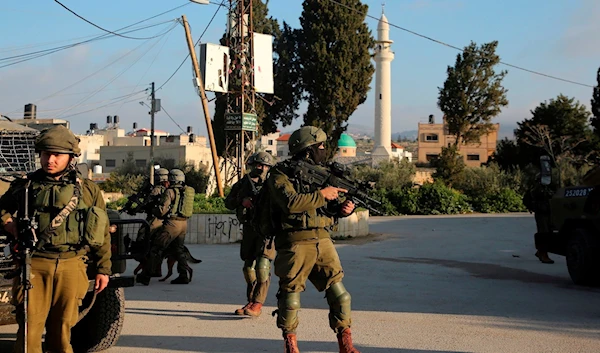 Israeli Occupation Forces raiding the occupied territories