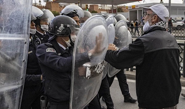 The protestors considered the visit a disgrace on the forehead of the Moroccan regime.