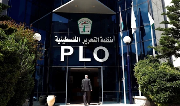 A man enters the headquarters of the Palestinian Liberation Organization (PLO), in Ramallah in the occupied West Bank September 10, 2018 (Credit: Reuters)