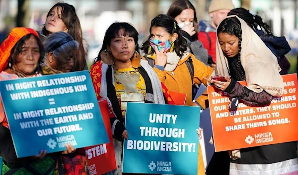 Indigenous people marching in Glasgow in protest of COP's treatment to their demands