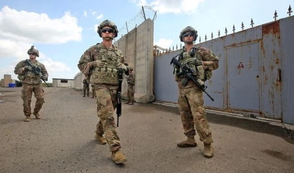 US soldiers guarding an air base northwest of Kirkuk, northern Iraq, in March (AFP)