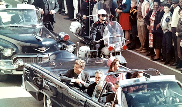 Picture of President Kennedy in the limousine in Dallas, Texas, on Main Street, minutes before the assassination.