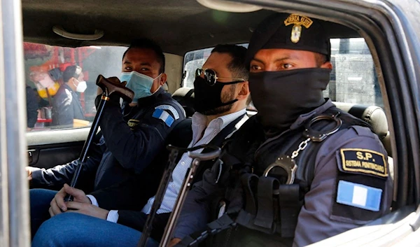 Ricardo Alberto Martinelli, son of Ricardo Martinelli, sitting in a car after a court hearing in Guatemala