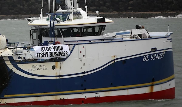 French fishing boats block the entrance to the port of Calais, northern France, on November 26, 2021 (AP)