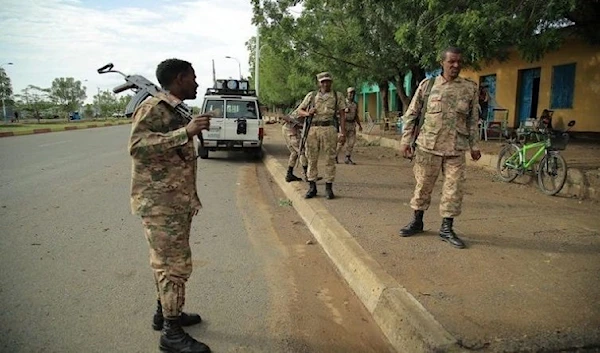 Members of Amhara Special Forces stand guard along a street in Humera town, Ethiopia July 1, 2021 (Reuters)