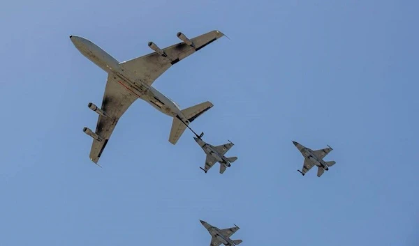 Israeli Boeing Stratotanker and F-16 fighter jets flying over Al-Quds