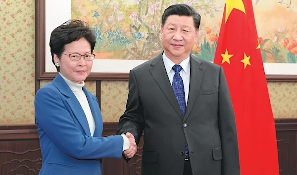 Chinese President Xi Jinping shaking hands with Hong Kong Chief Executive Carrie Lam