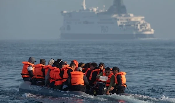 An inflatable boat carrying migrants across the Channel on 22 July, 2021, off the coast of Dover (Getty Images)