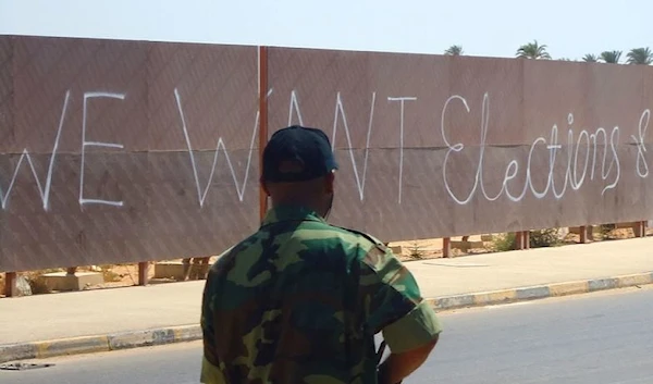 "We want elections & democracy": Benghazi graffiti.