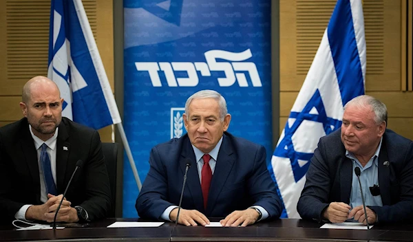 Israeli occupation Prime Minister Benjamin Netanyahu, center, at a Likud faction meeting on December 24, 2018