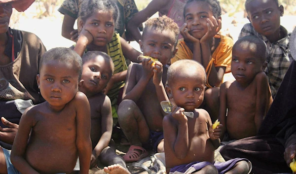 Children wait for food in the village of Fenoaivo, Madagascar, November 9, 2020 (Credit: AP)