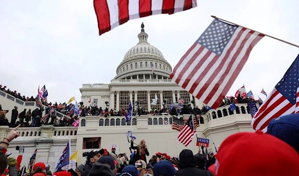 ro-Trump protesters climb the wall to enter the Capitol building complex in a riot in Washington, D.C. , U.S., January 6, 2021