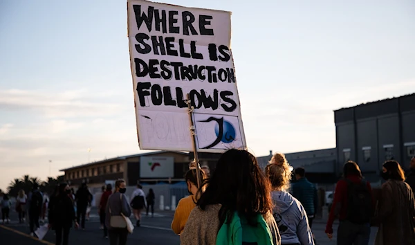 People gather at the Waterfront in Cape Town on 21 November 2021 to protest against Shell’s offshore exploration plan along the Wild Coast