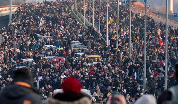 Thousands gathered on the main bridge in Serbia's capital, Belgrade.