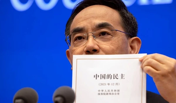 China named the government-produced report "Democracy that Works"