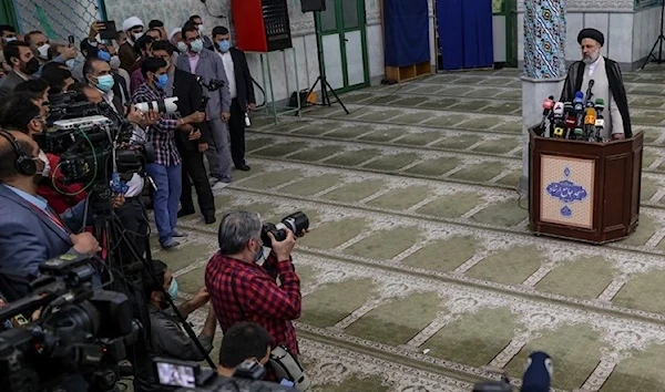 Raisi holds a press conference at a polling station in Tehran - June 18 (AFP).