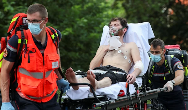 Asylum seeker on hunger-strike being transported to the hospital in Brussels | Credit: Reuters