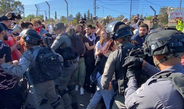 Israeli occupation forces arrest a Palestinian in Sheikh Jarrah Neighborhood