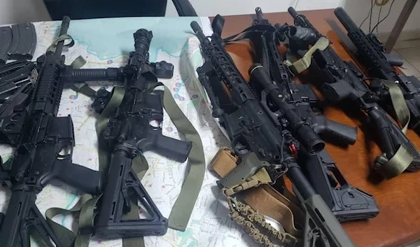 Weapons that were in possession of the suspected group, displayed by Haitian police