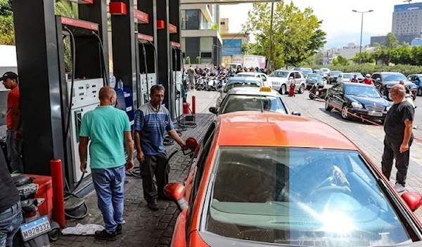 Drivers queue in front of a petrol station in the Lebanese capital, Beirut, August 13, 2021 (AFP).