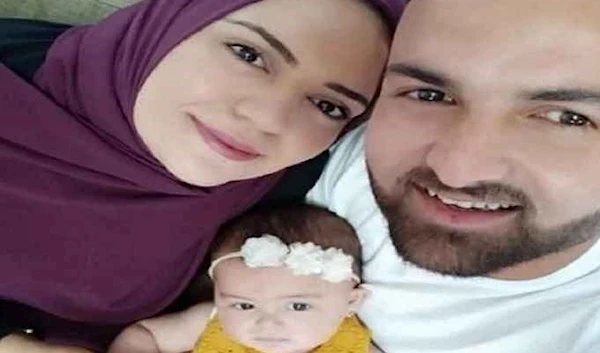 Anhar al-Deek with her husband and baby girl