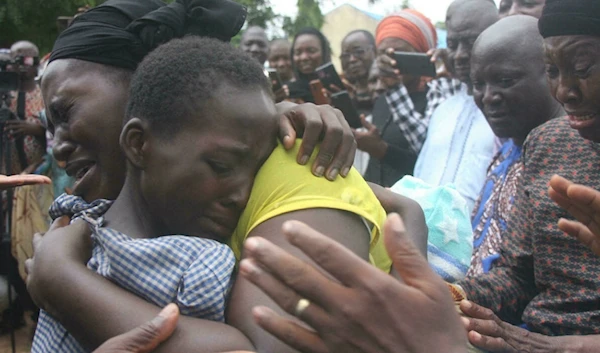 On July 25, a mother embraces her kidnapped son after his release in northwest Nigeria (AFP)