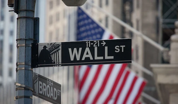 A Wall Street sign is displayed in front of the New York Stock Exchange (NYSE) in New York, US | Bloomberg