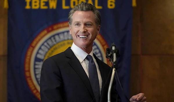 California Gov. Gavin Newsom addresses reporters after beating back the recall attempt that aimed to remove him from office, at the John L. Burton California Democratic Party headquarters in Sacramento, California, Tuesday, September 14 | AP