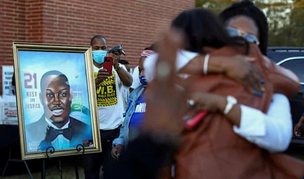 A portrait of Ahmaud Arbery at a vigil to mark the one year anniversary of his death, at New Springfield Baptist church in Waynesboro, Georgia | Reuters