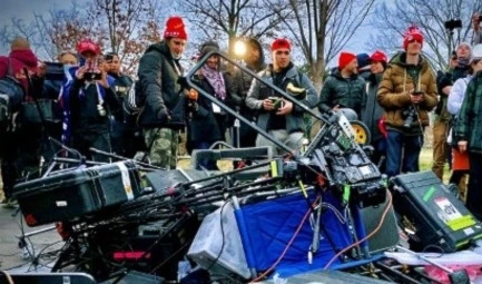 Trump supporters stand next to media equipment they destroyed during a protest on January 6, 2020 outside the Capitol in Washington, DC. (AFP)