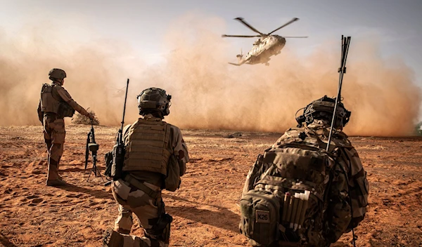 French Foreign Legion soldiers from the Operation Barkhane Counterterrorism Force taking positions as Merlin helicopters land in the Liptako-Gourma zone in northeastern Mali.