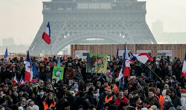 Protestors gathering near the Eiffel Tower in Paris (AFP)