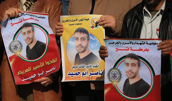 Posters of Palestinian prisoner Nasser Abu Hamid