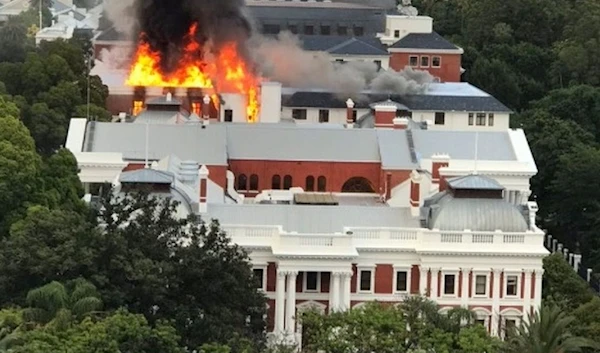 Flames were bursting from the roof and a plume of smoke could be seen from far away