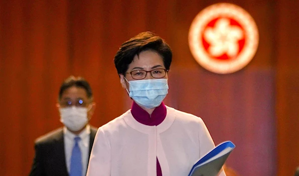 Hong Kong Chief Executive Carrie Lam reacts as she leaves the chamber after delivering her final annual policy address at the Legislative Council in Hong Kong, China, October 6, 2021 (Reuters)