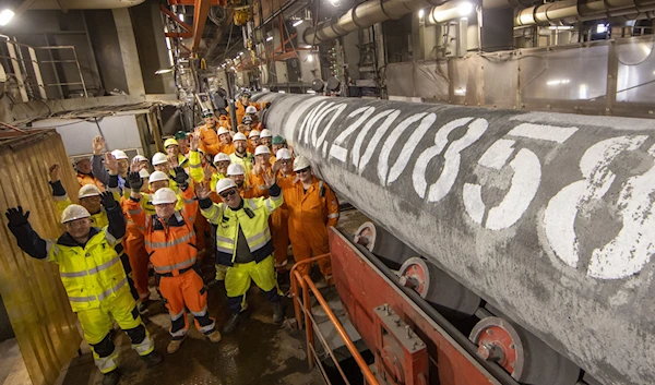 Construction workers celebrating the completion of Nord Stream 2 natural gas pipeline