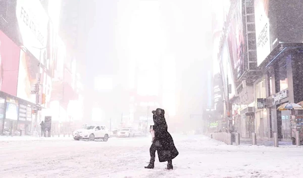 A person walks in Times Square on 29 January.