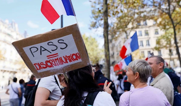 Medical staff demonstrate against mandatory Covid-19 vaccinations on September 11, 2021 (AFP)