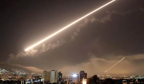 Syrian air defenses intercepting Israeli rockets