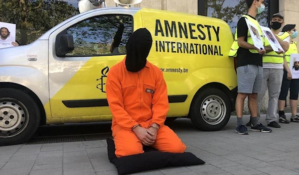 Amnesty International holding protests to mark the 20th anniversary of the opening of the Guantanamo Bay