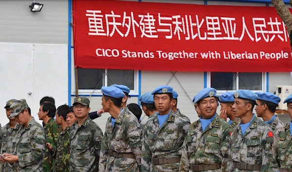 Members of a 160-strong Chinese army medical team attend the opening of a $41 million Chinese-funded ebola treatment hospital, Monrovia, Liberia, November 25, 2014 (AFP)