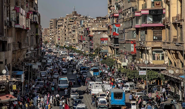 People crowd a street in Cairo, Egypt on April 14, 2020 (AP Photo/Nariman El-Mofty, File)