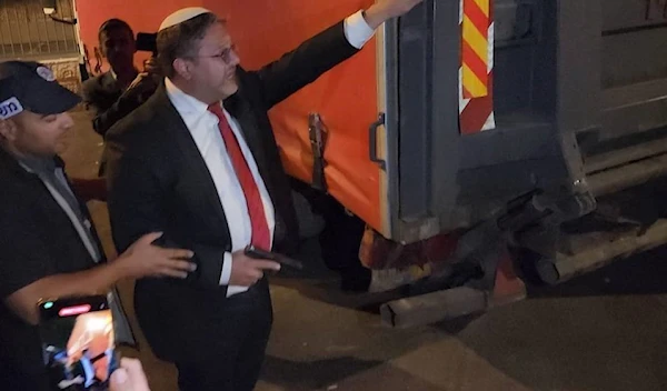 Knesset Member Itamar Ben-Gvir holding a pistol in Sheikh Jarrah neighborhood, occupied Al-Quds